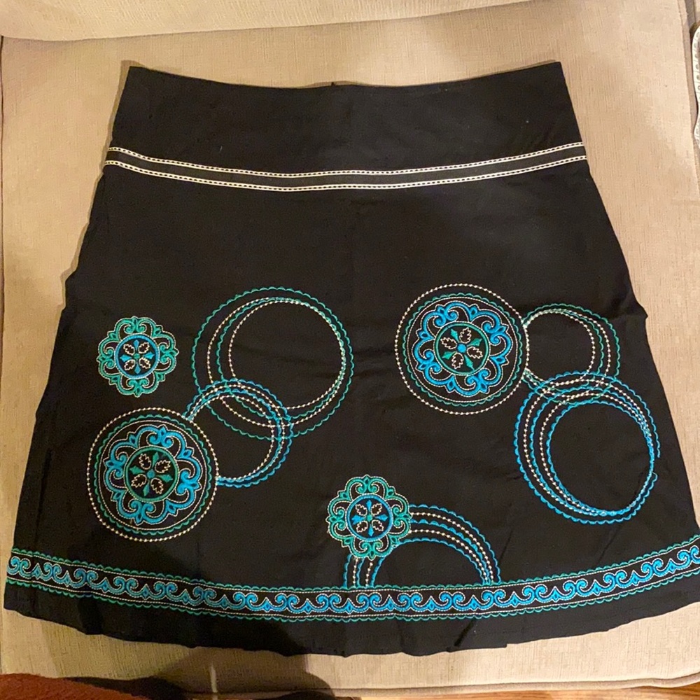 A line skirt black with very vibrant color patterns.